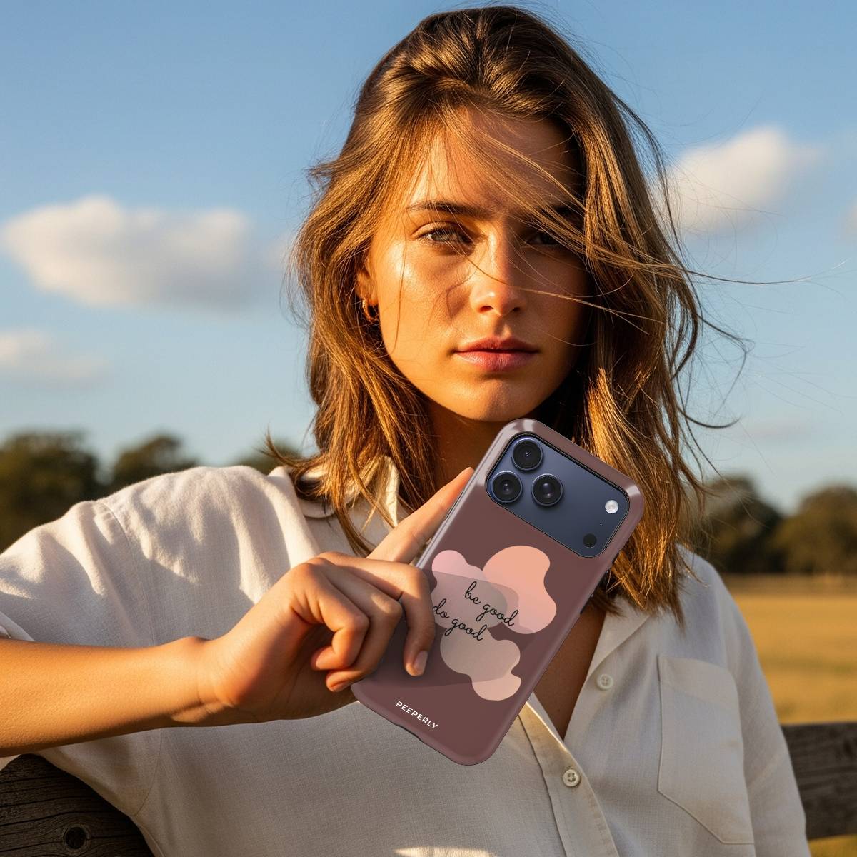 Inspire Goodness Crystal Series iPhone case in hand lifestyle image