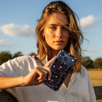 Neon Wings Crystal Series iPhone case in hand lifestyle image